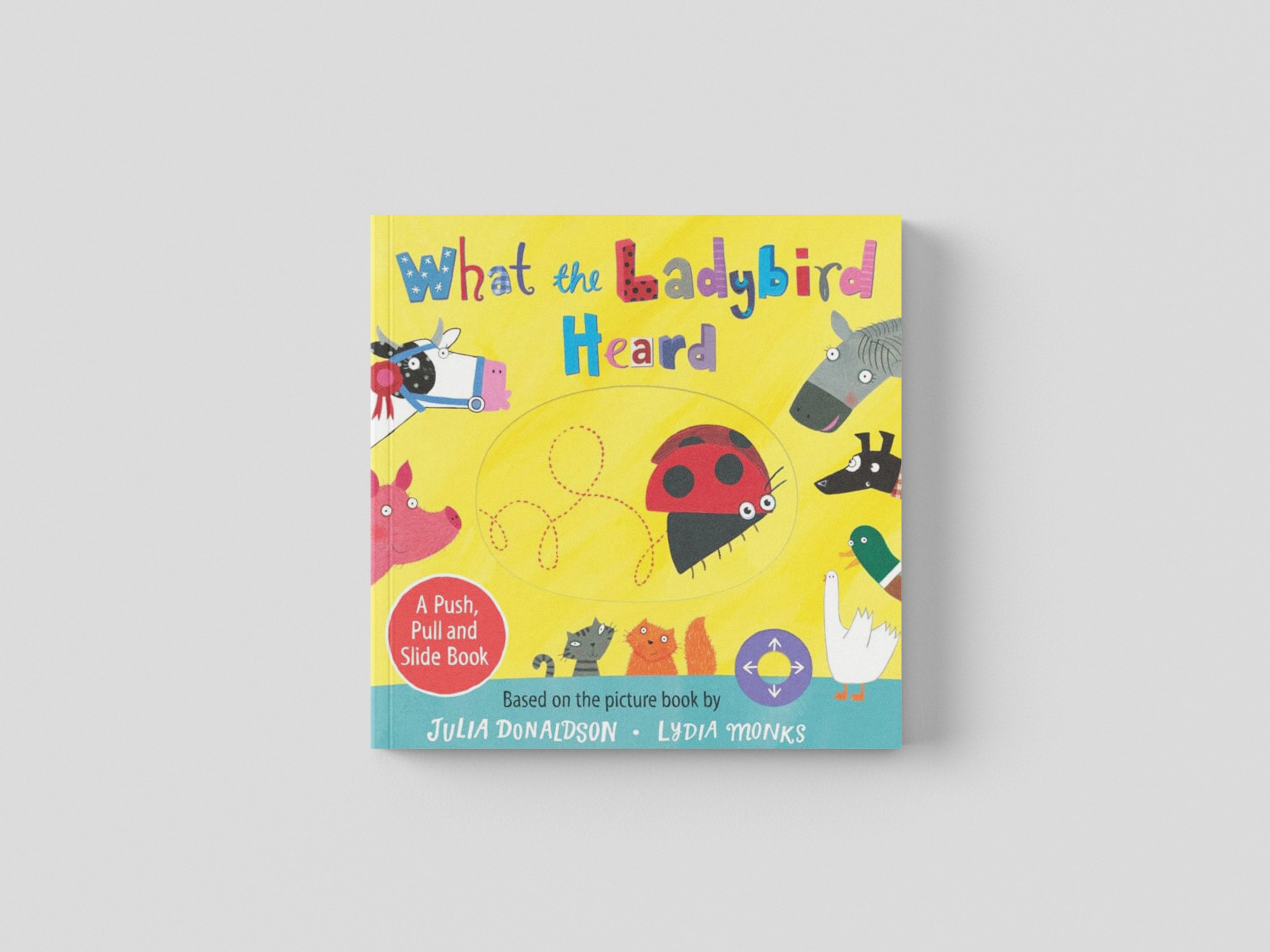 What the Ladybird Heard: A Push, Pull and Slide Board Book Board book